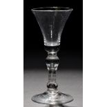 Baluster wine glass, the waisted bowl with a solid base, raised on a teared inverted baluster stem,