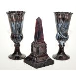 Three pieces of marbled purple glass of 'North East' interest,