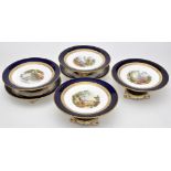 Eighteen-piece bone china dessert service, each delicately painted with individual rural scenes,