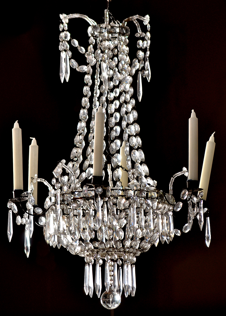 A cut glass lustre chandelier, fitted six candle sconces, 80cms (31 1/2in.) high.