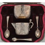 A Victorian cased sugar bowl, cream jug, teaspoons and tongs (incomplete),