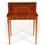 An Edwardian inlaid mahogany ladies writing desk, decorated throughout with boxwood stringing,