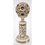 Chinese carved ivory puzzle ball on stand,