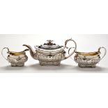 A George III three piece tea service, by Solomon Hougham, Solomon Royes and John East Dix,