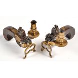 Two 19th/20th Century flintlock lighters, with brass mounts and sconce, slab sided walnut grips,