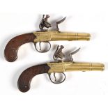 A pair of late 18th/early 19th Century flintlock pistols,