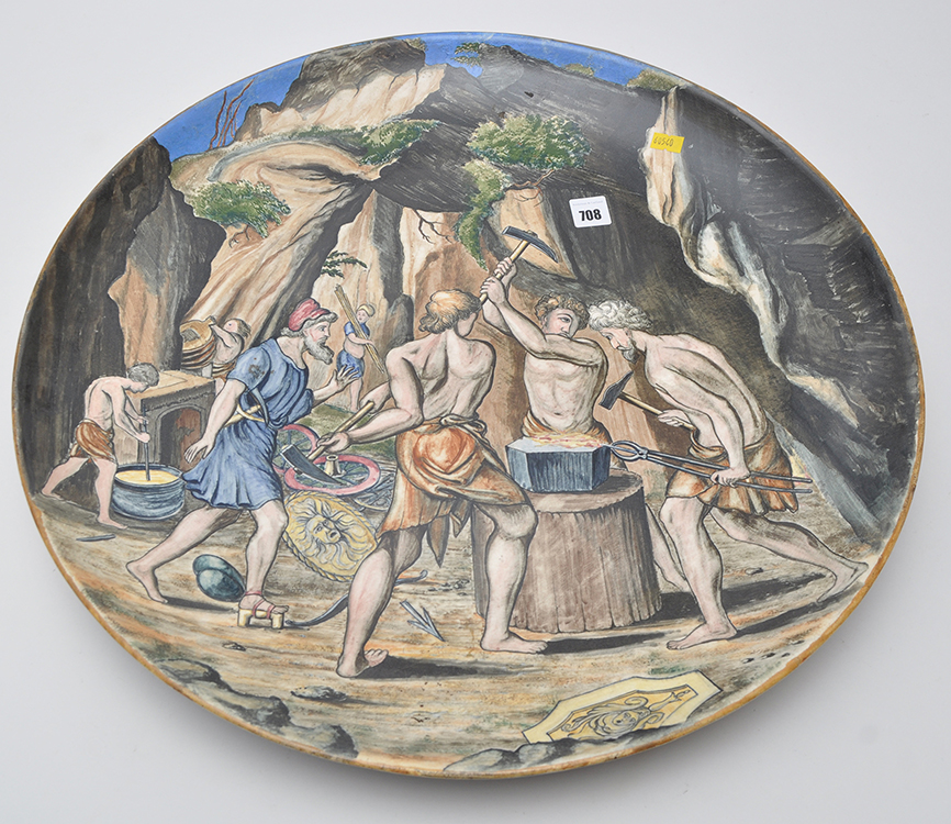 Painted earthenware charger, with "The Cyclops here their heavy Hammers deal",