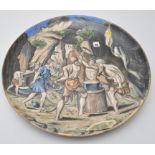 Painted earthenware charger, with "The Cyclops here their heavy Hammers deal",