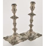 A pair of 18th Century white metal candlesticks, probably early Old Sheffield plate,