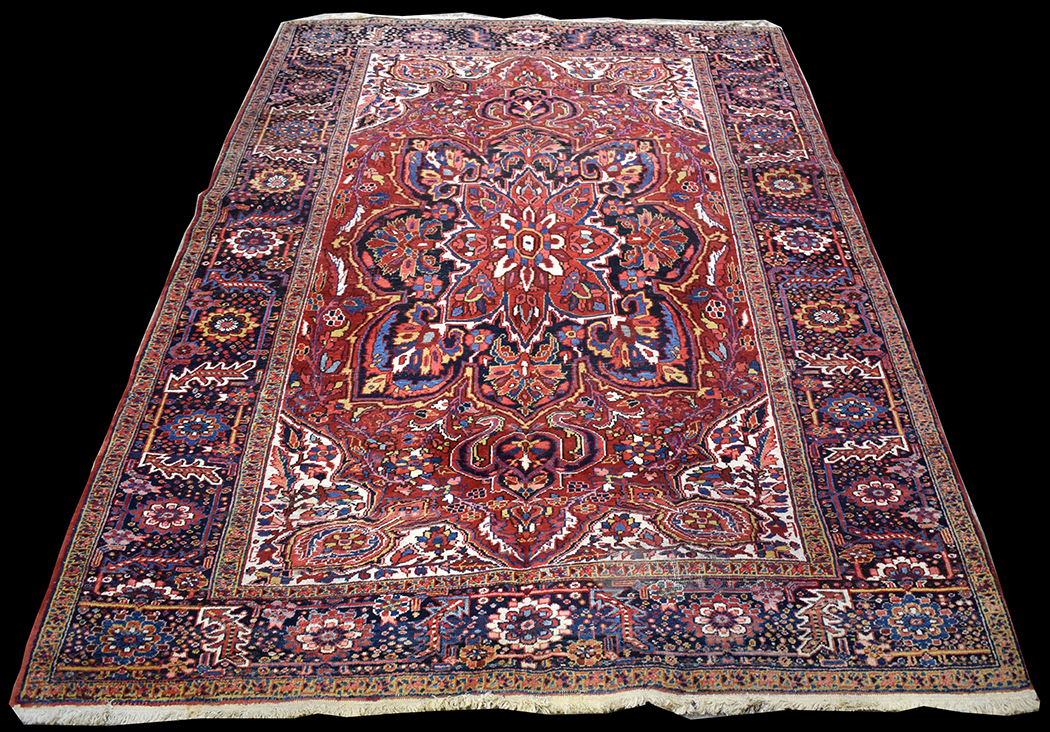 A Heriz carpet, with geometric floral decoration throughout, 361 x 251cms (142 x 99in.).