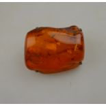 A large specimen of amber in four-claw b