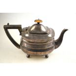 An oblong silver teapot in the Georgian