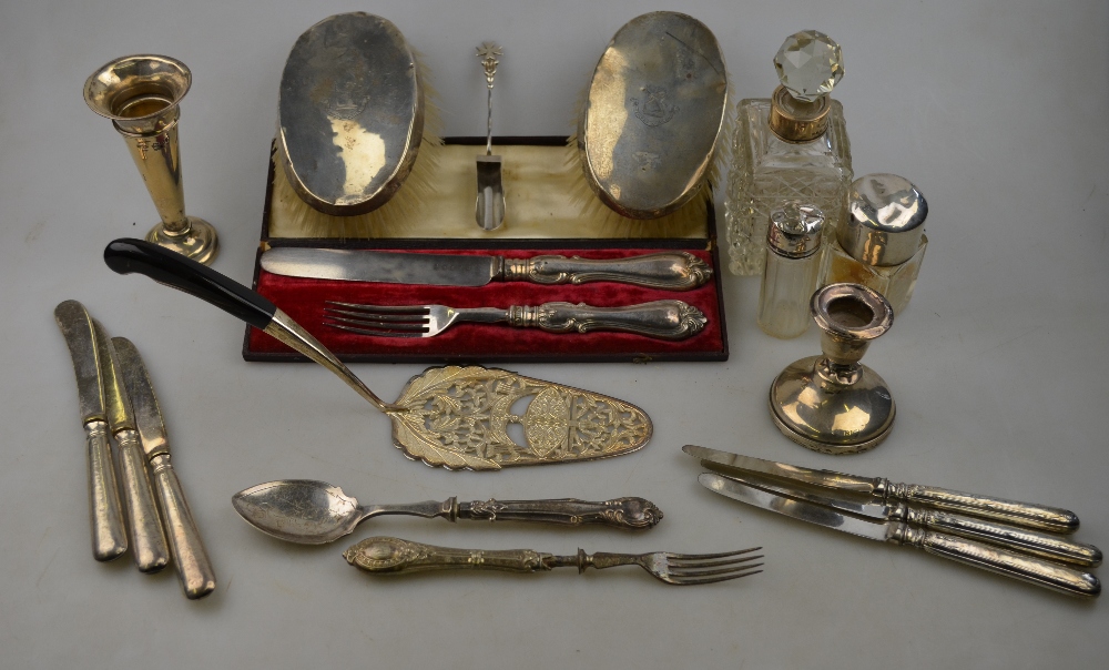 A quantity of sundry silver-mounted items, including a cased knife and fork, a .