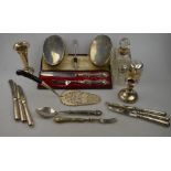A quantity of sundry silver-mounted items, including a cased knife and fork, a .