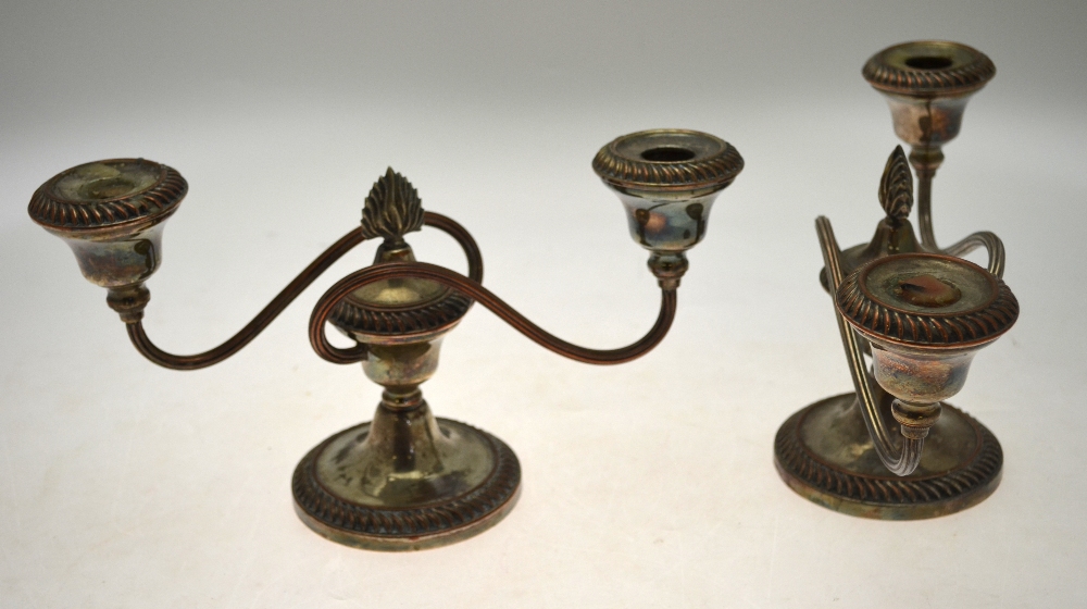 A pair of Matthew Boulton Old Sheffield Plate twin branch candelabra with gadrooned rims and reeded