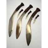 Three military style kukris with wood-mounted hilts and leather scabbards - all a/f