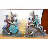 A pair of relief carved polychrome figures, one pair seated the others dancing,