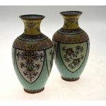 A pair of Chinese cloisonne ovoid vases with waisted necks,