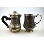 A 19th century German pear-shaped small hot milk jug, the domed cover with cherub mask,