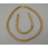 A yellow and white gold coiled mesh necklace and matching bracelet approx 45 g stamped 750