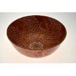 A 19th century Japanese Kutani bowl decorated in iron red and gilding with floral and foliate