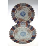 A pair of Japanese Imari porcelain plates having a hexagonal pattern border, Meiji, 22.5 cm diam