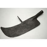 An antique wrought iron broad-bladed axe-head with rear spike,