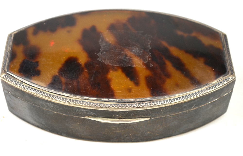 A silver trinket box of tonneau form with tortoiseshell inset cover, E. S. Barnsley & Co.