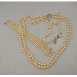 A two-row simulated pearl necklace, simulated pearl bracelet to/w one other simulated bracelet a/f