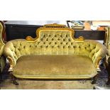 A Victorian inlaid walnut show-framed button backed salon sofa with shaped corner,