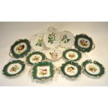 A Ridgway part dessert service, floral moulded dark green borders painted with fruit to the
