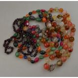 A garnet bead necklace to/w faceted glass beads in autumnal colours,