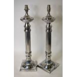 A pair of electroplated reeded pillar table lamps,