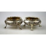 A pair of Victorian silver open salts in the Georgian manner with floral and foliate embossed