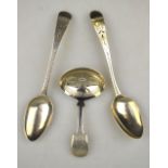 A George III silver fiddle pattern caddy spoon with engraved oval bowl (maker's mark rubbed),