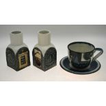 Two Troika spice jars decorated with geometric textured sides,