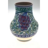 A Poole Pottery Carter, Stabler & Adams vase decorated with the grape design, circa 1930s, 29 cm