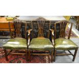 A set of eight 19th century mahogany dining chairs with arched backs over pierced vertical splats