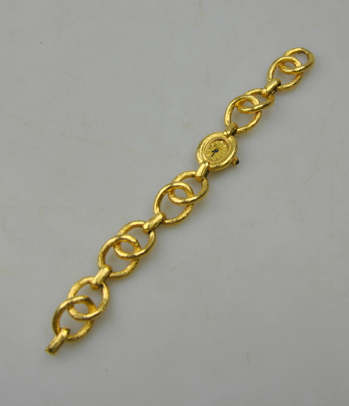 A lady's Kutchinsky 18ct gold wristwatch, the 17 jewel Chopard movement with cabochon sapphire-set