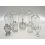 A collection of Continental clear glass comprising five large rectangular bottles 24 cm - 25.5 cm