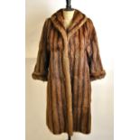 A shadowed musquash full-length fur coat with cuffed sleeves and brown satin lining, 53 cm across