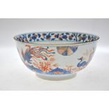 A Chinese early 18th century Imari porcelain bowl decorated with fabulous birds amidst prunus, 31.