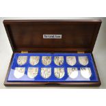 A cased set of twelve Danbury Mint 'The Royal Arms' silver shield ingots, with certificates.  18.