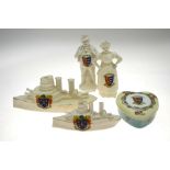 A collection of crested wares to include Arcadian china WWI tank and two battleships