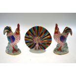 A pair of Herend porcelain cockerels, 23.5 cm high and a peacock, 11 cm high (3) Condition Report