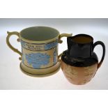 A Victorian Doulton Lambeth Dewars whisky jug, to/w a large glazed pottery two-handled wassailing