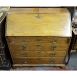 An 18th/19th century mahogany bureau having a fitted interior over four long graduated drawers