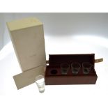 A modern Alfred Dunhill 'Tradition Touring' set of four crystal shot-glasses in fitted leather case