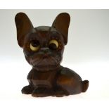 A continental novelty Oswald rolling eye dog clock, the carved walnut case as a small dog with