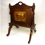 A 19th century mahogany newspaper/folio stand having hinged panels,